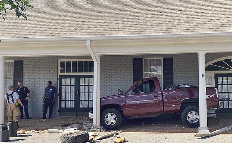 While details have not been released the driver of the pickup truck told the Natchitoches Times he was traveling west on Keyser Ave. when he swerved to miss aanother vehicle who pulled in front of him. The truck hit the curb, hydoplaned and landed in the entryway of Blanchard –St Denis Funeral Home located in the 800 block of Keyser Avenue. No injuries were reported.