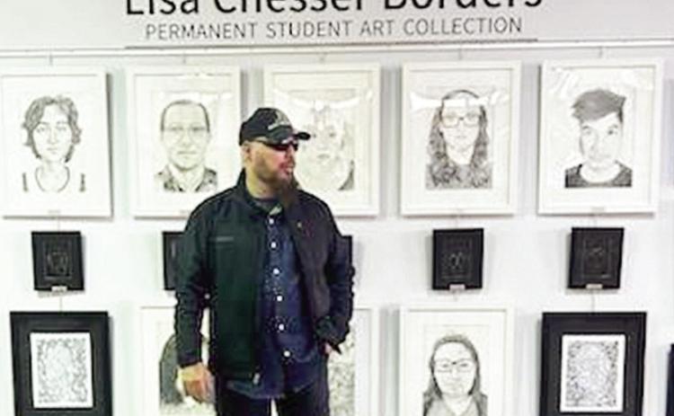 James Borders stands in front of his late wife’s Permanent Student Art Collection housed within Eugene P. Watson Memorial Library’s Academic Success Center.